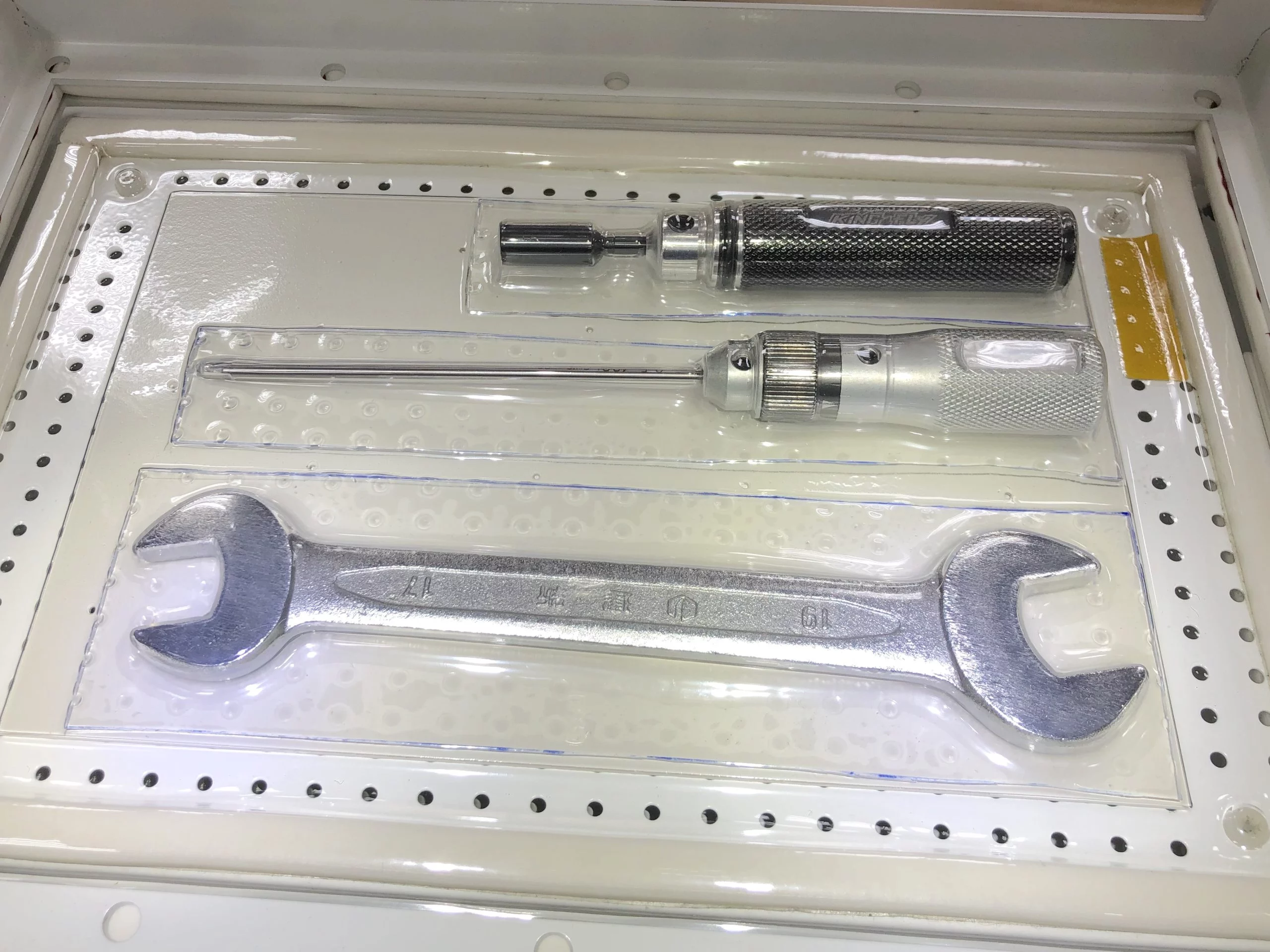 Screwdriver and wrench covered with flexible TPU plastic sheet