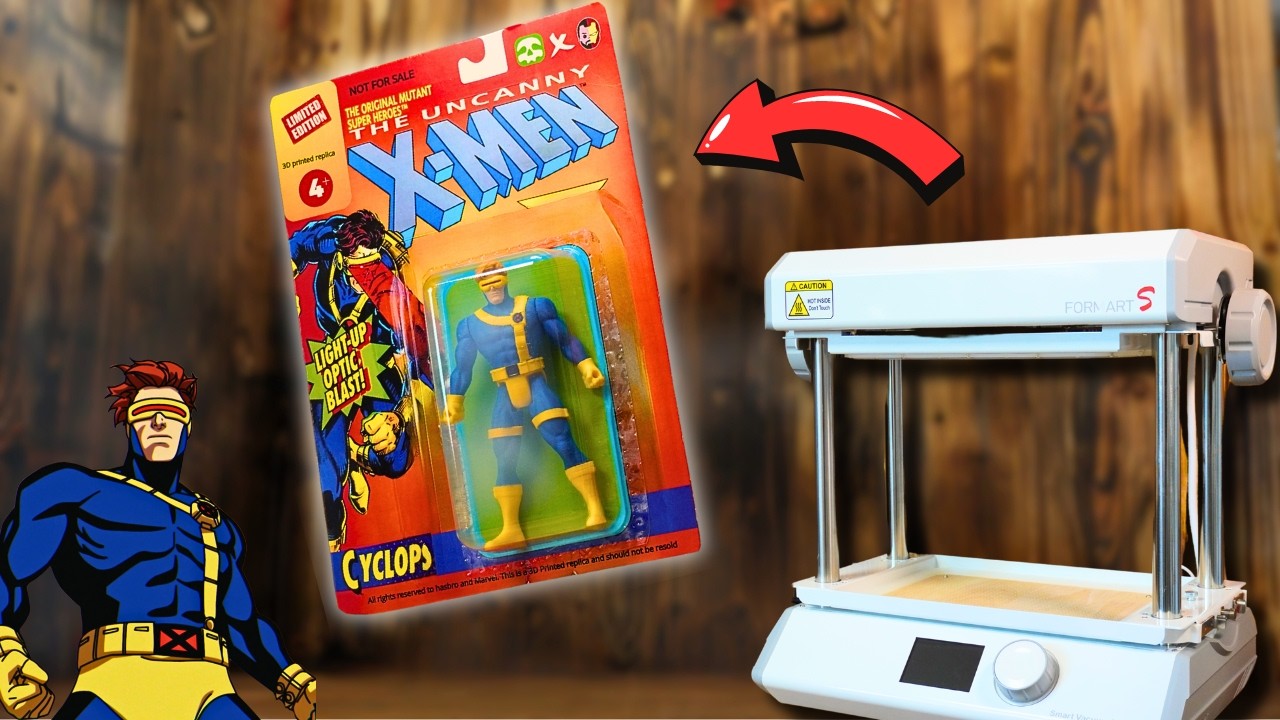 A small vacuum forming machine sits next to a hanging clamshell contains with figurines