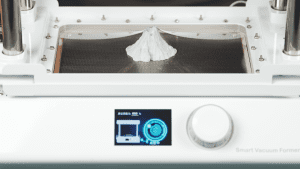 Using the FORMART S Smart Vacuum Former to create a volcano-shaped mold, with the display showing the forming process.