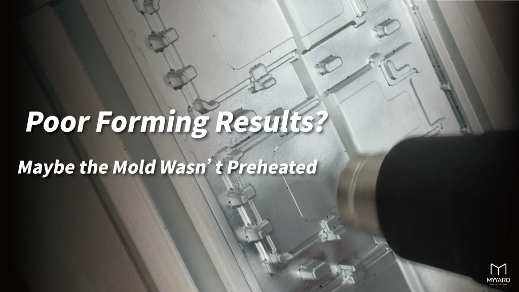 Using a heat gun to preheat an aluminum mold before vacuum forming