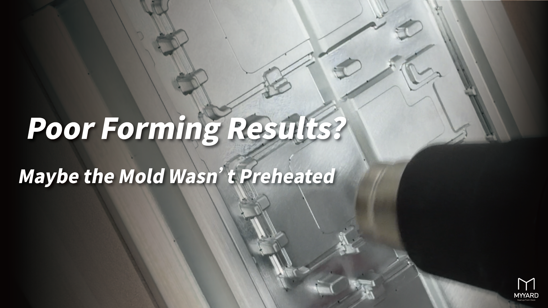 Using a heat gun to preheat an aluminum mold before vacuum forming