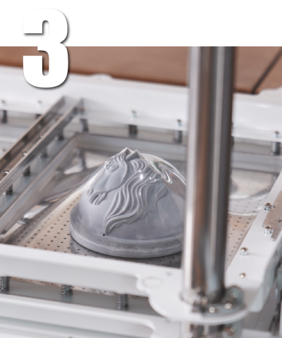 MYYARD 4 step-3 Step 3: Vacuum forming a clear plastic sheet over a horse-shaped mold using a FORMART vacuum former